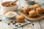 Freshly baked almond flour muffins on a rustic table