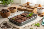 Tray of fudgy, cakey, and chewy brownies on a rustic table