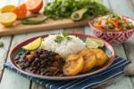 Plate of Cuban black beans with rice, plantains, and salad