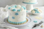 Fluffy cloud cake with pastel blue and white buttercream